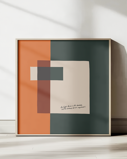 Framed abstract art print with geometric shapes on a white wall.