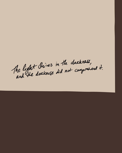 John 1:5 Light Shines in the darkness on a beige background with a brown border